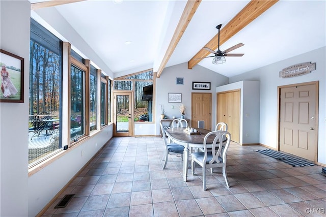 dining space featuring tile patterned flooring, vaulted ceiling with beams, and ceiling fan