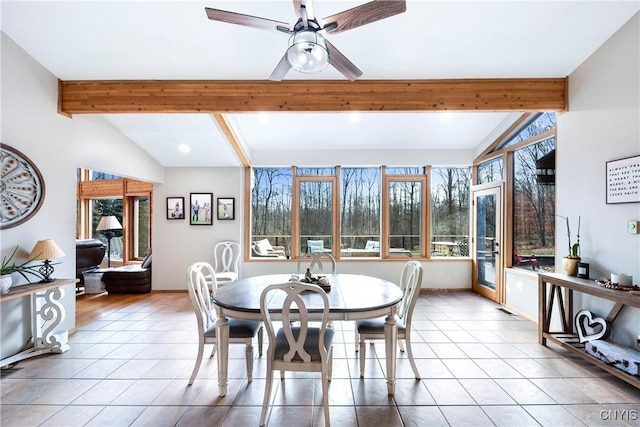 tiled dining area with lofted ceiling with beams and ceiling fan