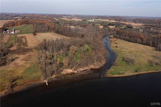 birds eye view of property with a rural view and a water view