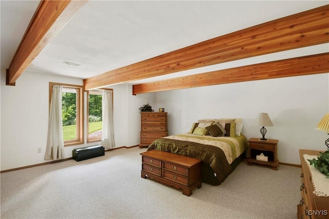 bedroom featuring beam ceiling and light carpet