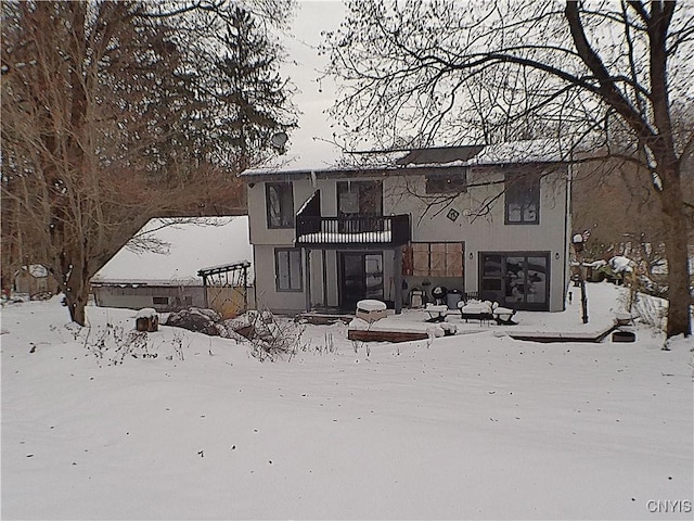 snow covered house with a balcony