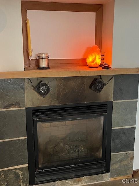 interior details with a tiled fireplace