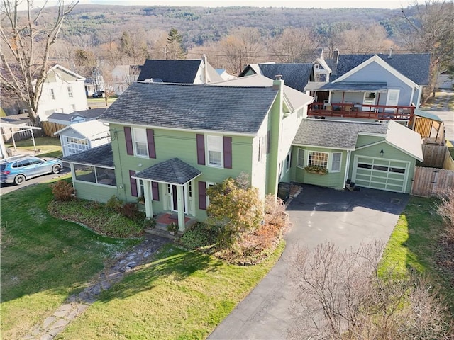 view of front facade with a front yard and a garage