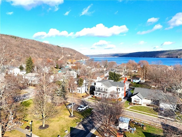 drone / aerial view with a water and mountain view