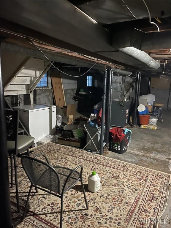 basement featuring fridge