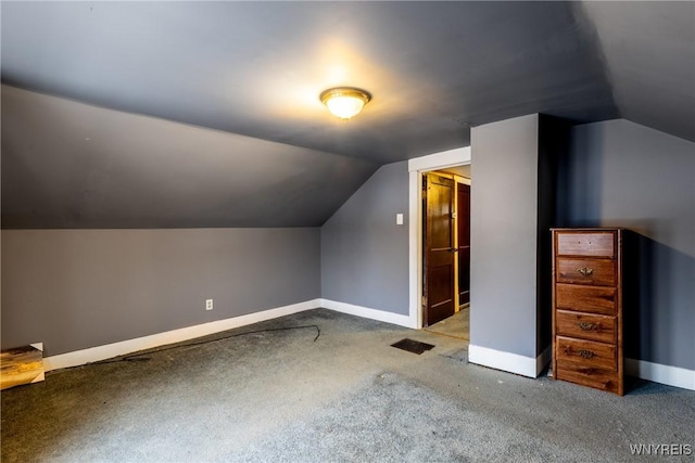 bonus room featuring carpet flooring and vaulted ceiling