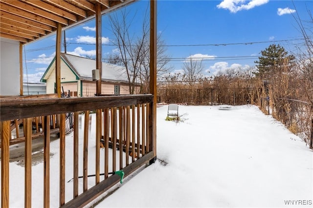 view of snow covered deck