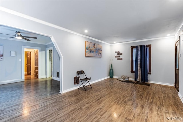 unfurnished room featuring ornamental molding, dark hardwood / wood-style floors, and ceiling fan