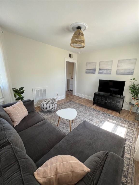 living room with light hardwood / wood-style floors