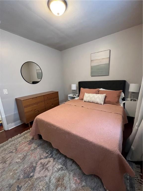 bedroom featuring dark wood-type flooring