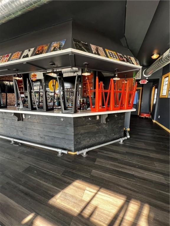 bar featuring dark hardwood / wood-style floors