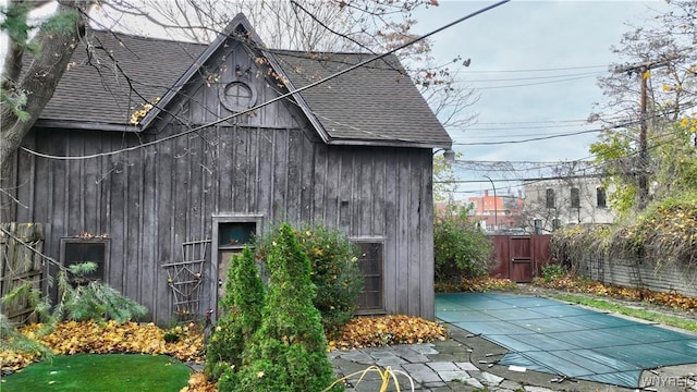 view of side of property with a patio area