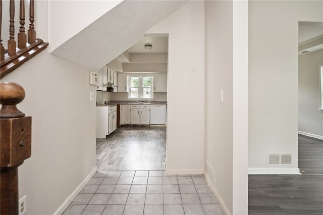 corridor with light hardwood / wood-style flooring