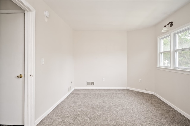 unfurnished room featuring carpet flooring