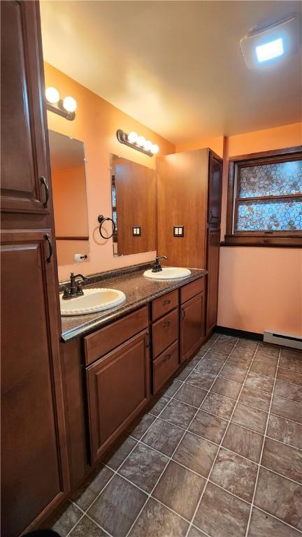 bathroom featuring vanity and a baseboard heating unit