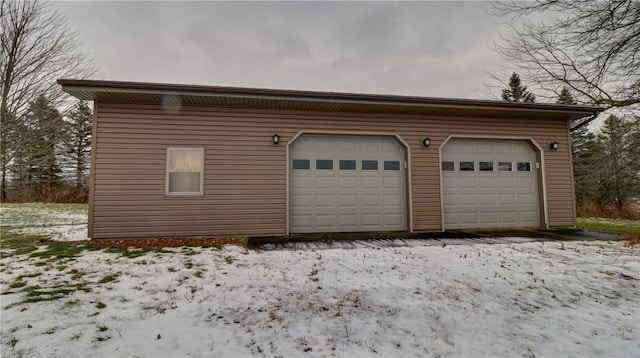 view of snow covered garage