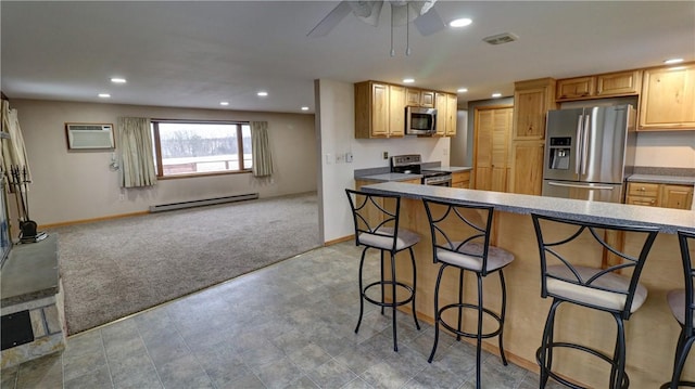 kitchen with light carpet, stainless steel appliances, baseboard heating, ceiling fan, and an AC wall unit