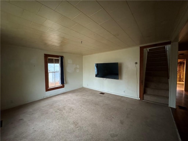 unfurnished living room featuring carpet floors