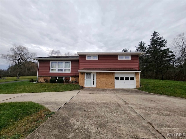 tri-level home with a front yard and a garage