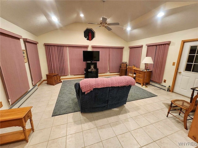 tiled home theater with baseboard heating, ceiling fan, and vaulted ceiling