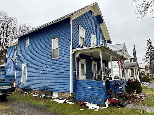 view of home's exterior with a porch