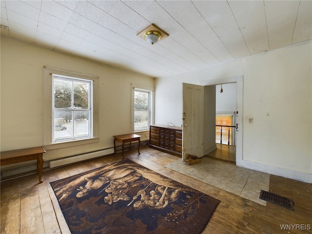 interior space with wood-type flooring and a wealth of natural light