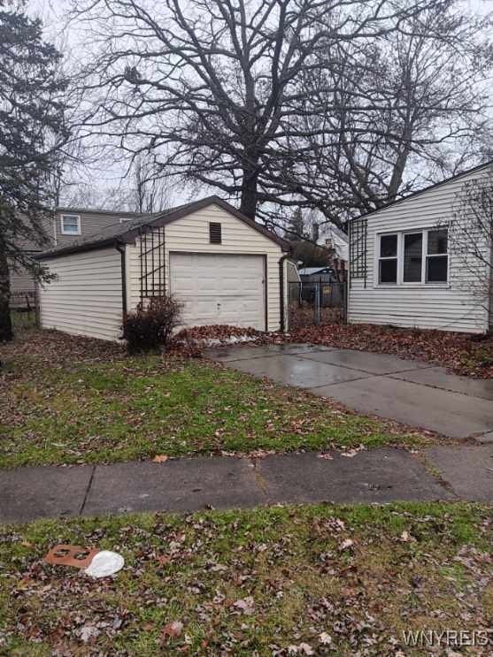 view of side of property featuring a garage