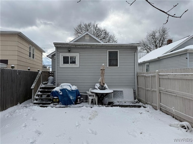 view of snow covered house