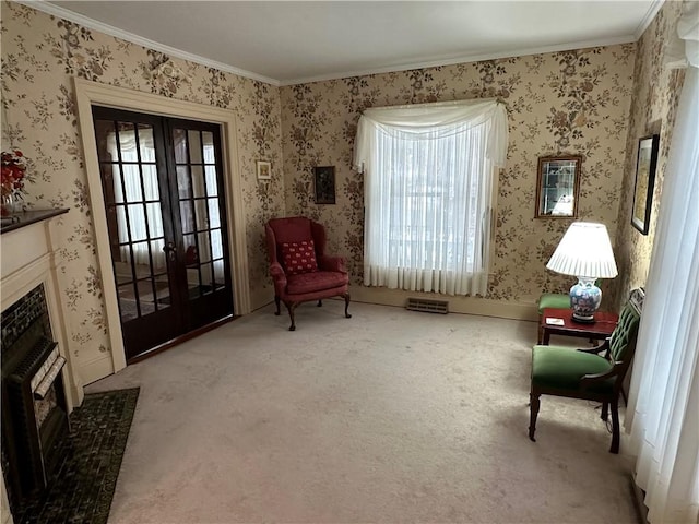 sitting room with french doors, light colored carpet, and crown molding