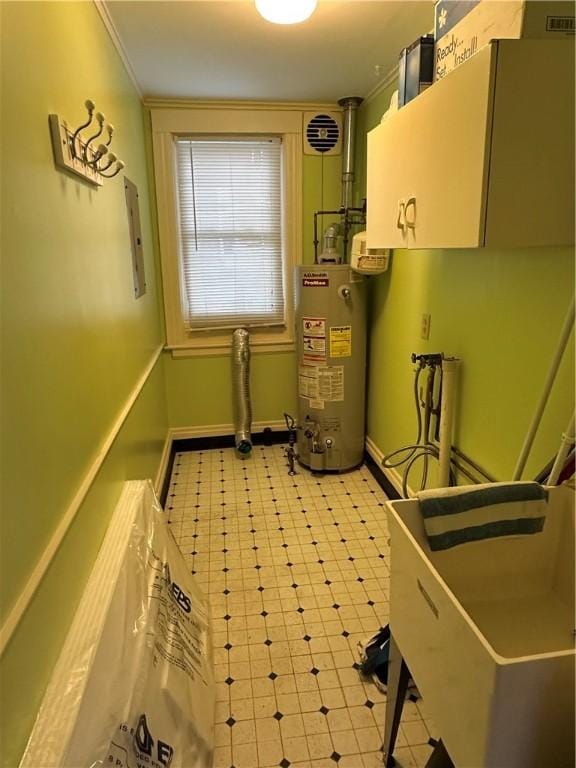 utility room featuring water heater