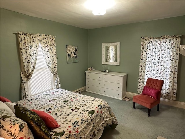 bedroom featuring carpet flooring and a baseboard heating unit