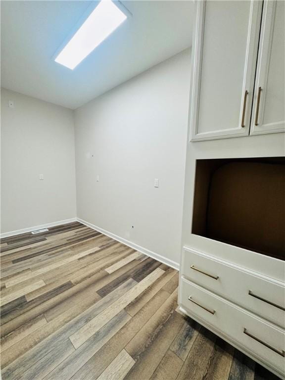 unfurnished room featuring hardwood / wood-style floors