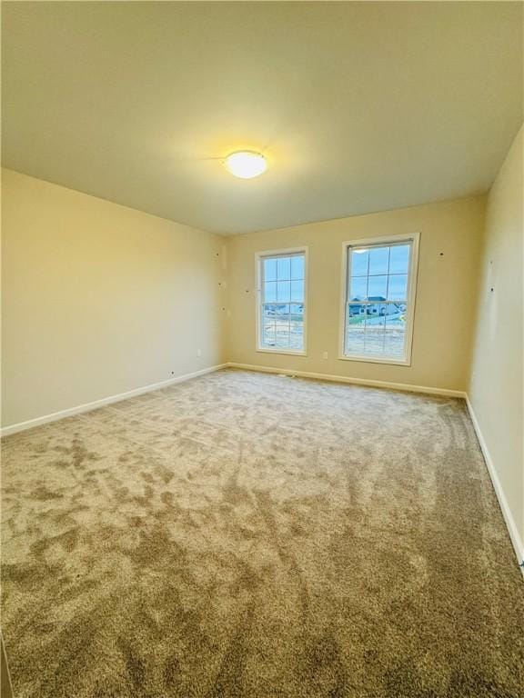 view of carpeted spare room