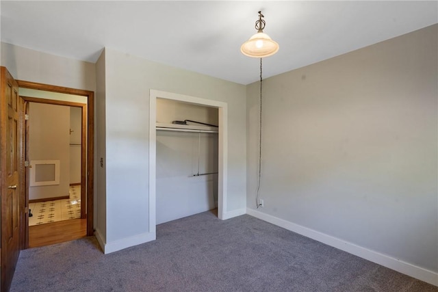 unfurnished bedroom with carpet and a closet