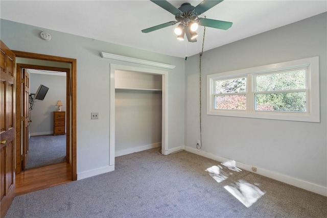 unfurnished bedroom with carpet floors, a closet, and ceiling fan