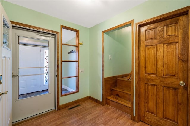 foyer entrance with light hardwood / wood-style flooring