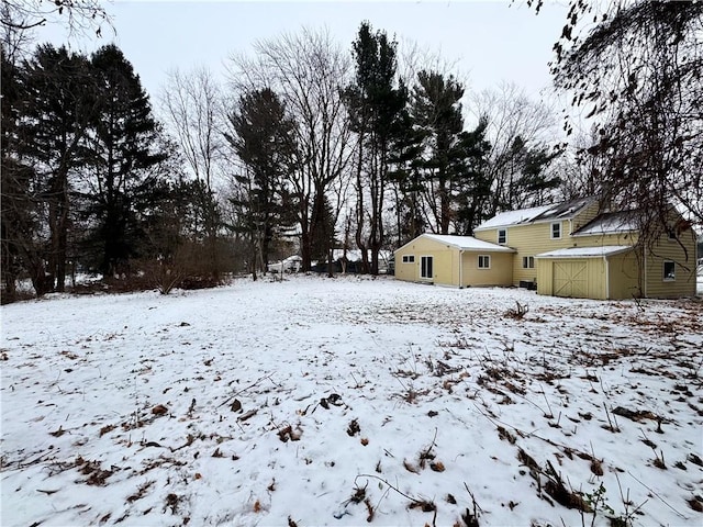 view of yard covered in snow