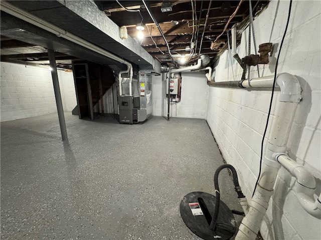 basement with gas water heater and heating unit