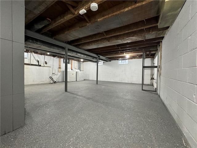 basement with washer and clothes dryer