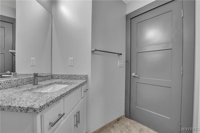 bathroom with tile patterned floors and vanity