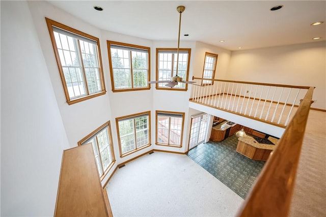 living room with plenty of natural light and ceiling fan