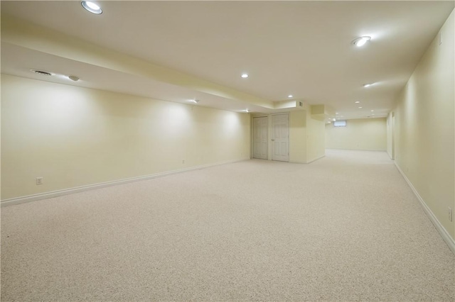 basement with light colored carpet