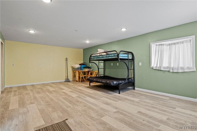 bedroom with recessed lighting, baseboards, and light wood finished floors