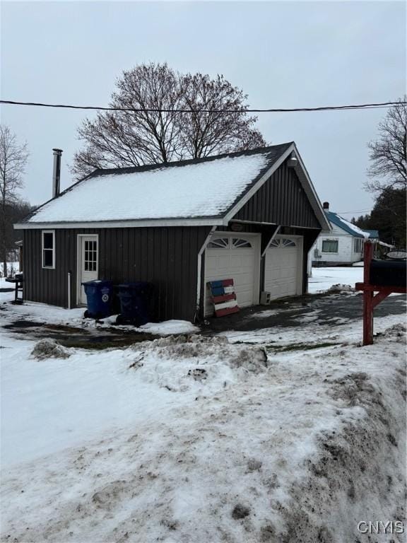 view of snow covered garage