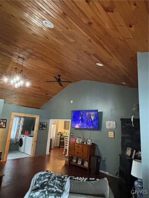 living room with ceiling fan, separate washer and dryer, hardwood / wood-style floors, lofted ceiling, and wood ceiling