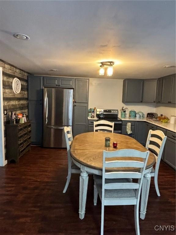 dining space with dark hardwood / wood-style floors