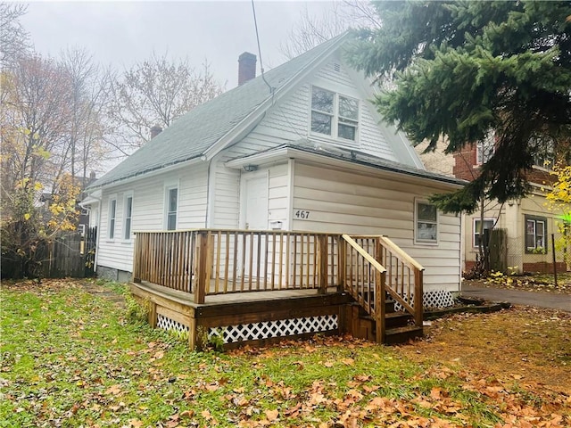 rear view of house with a wooden deck