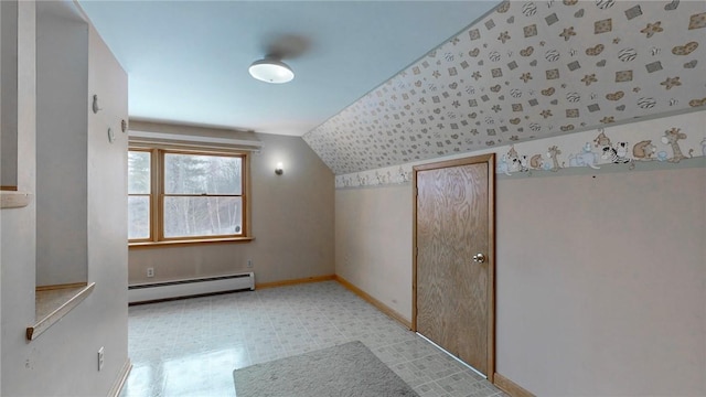 bonus room with baseboard heating and vaulted ceiling