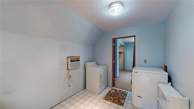 washroom featuring an AC wall unit, light carpet, and washing machine and clothes dryer