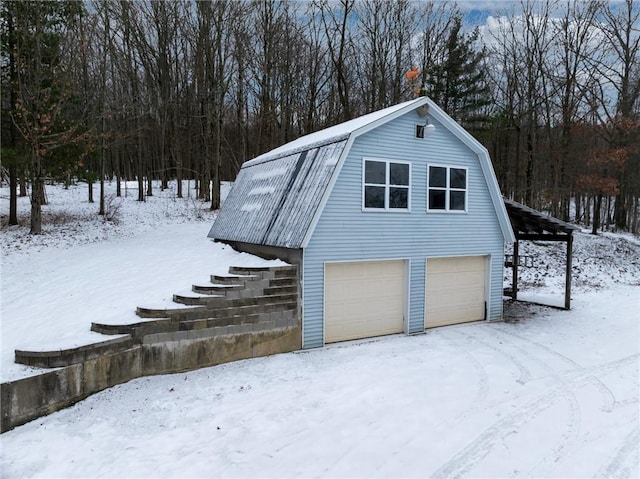 view of snow covered garage